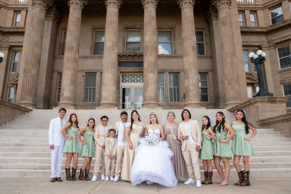 Wedding party on the steps of a columned building